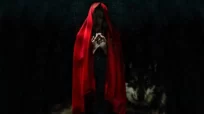 Alkarısı: Kırmızılar İçinde Cadı Benzeri Bir Kadın